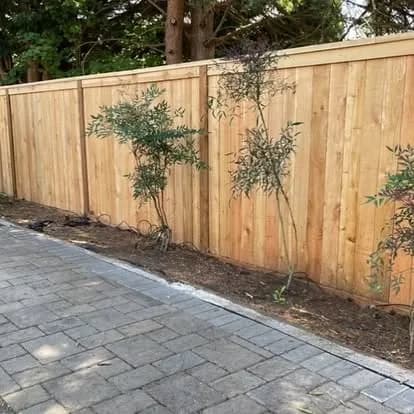 Wood fence installation by GI Landscape