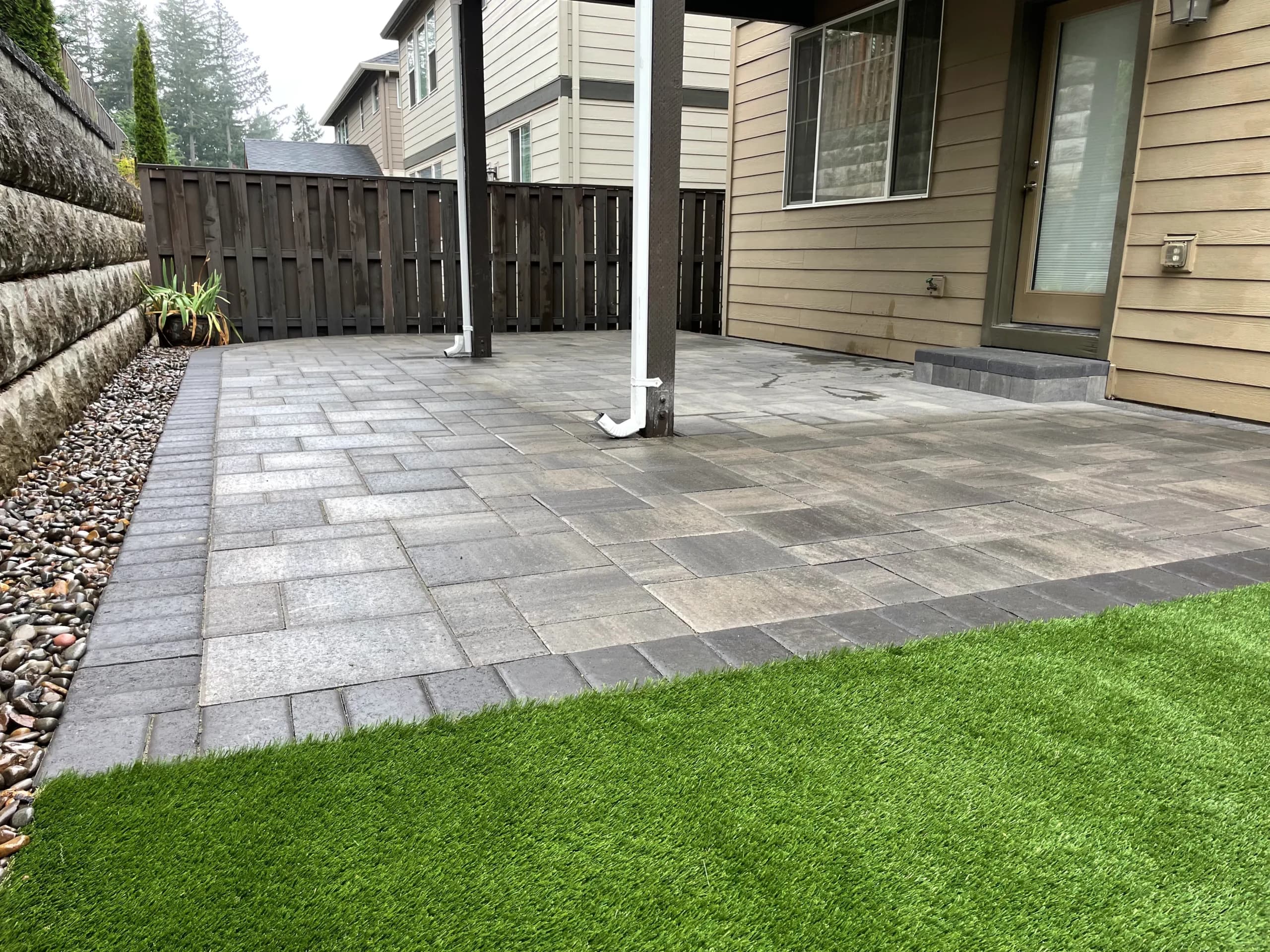 Paver patio with artificial turf and retaining wall combo