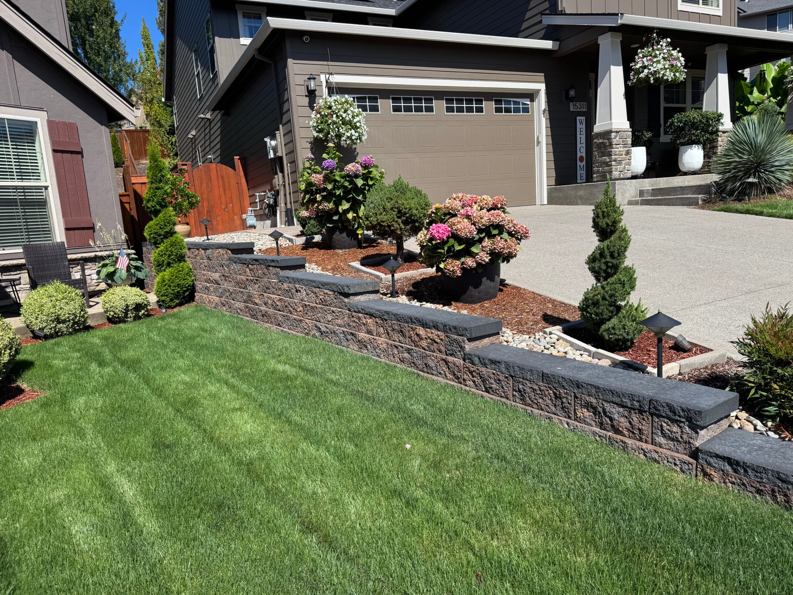 Segmental block retaining wall with new plantings